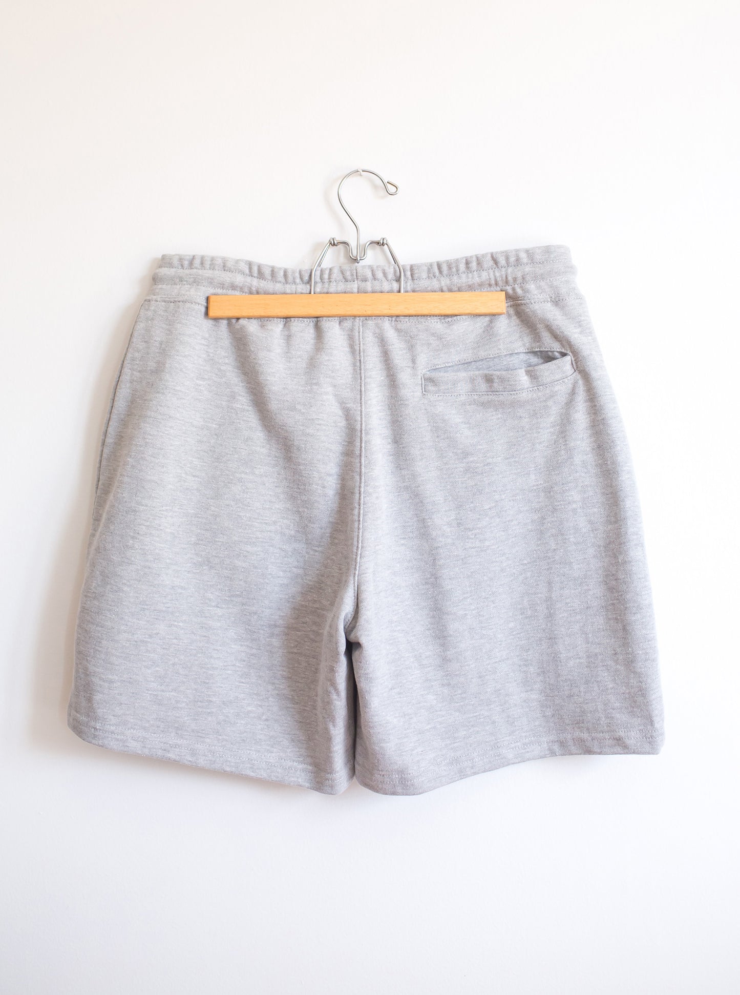 Back of heather grey cotton sweatshorts with back pocket