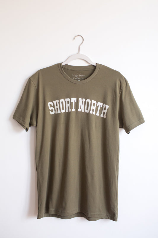 Dusty green sueded crewneck tee with white Short North graphic at front.