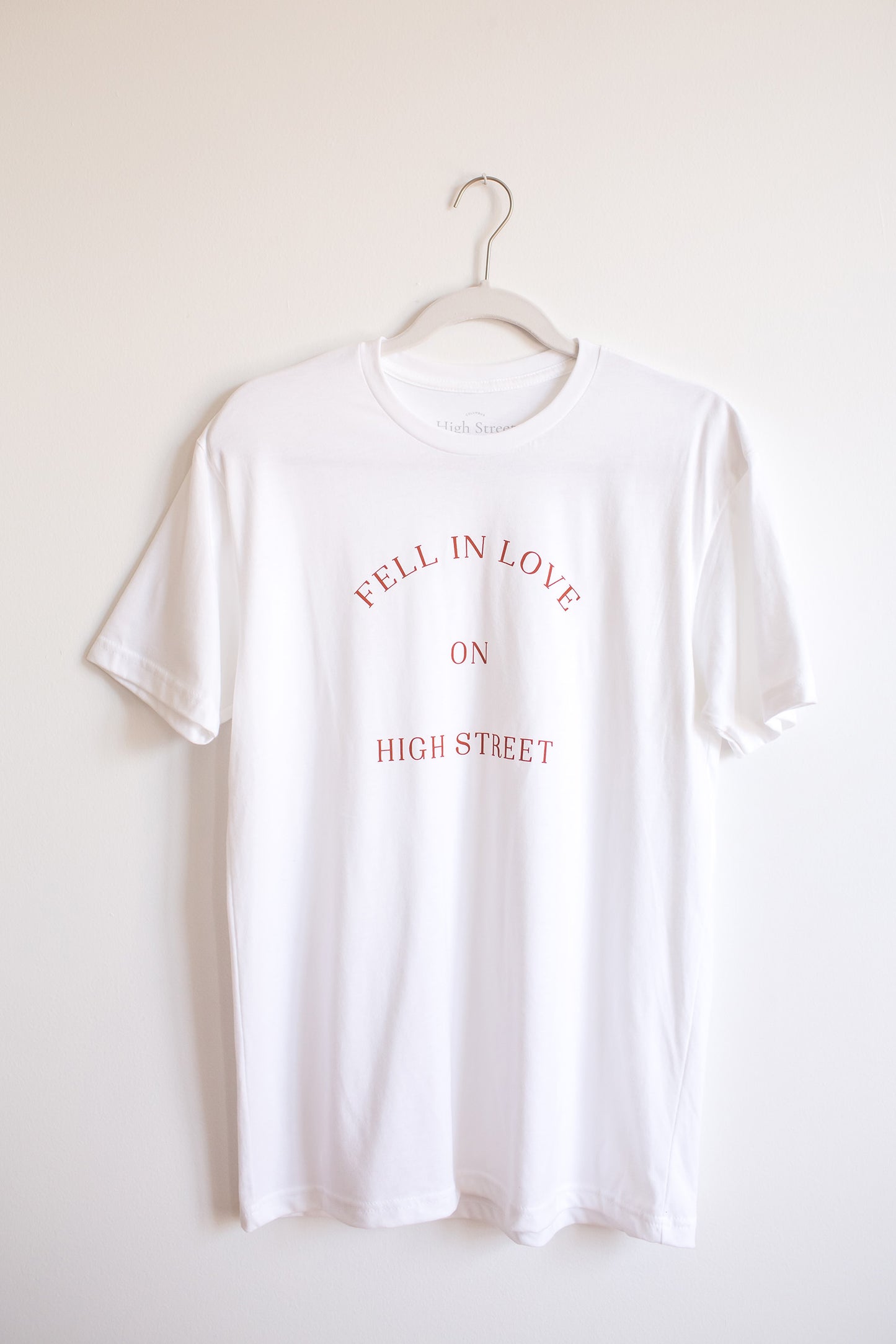 White sueded crewneck tshirt with Fell In Love On High Street graphic at front