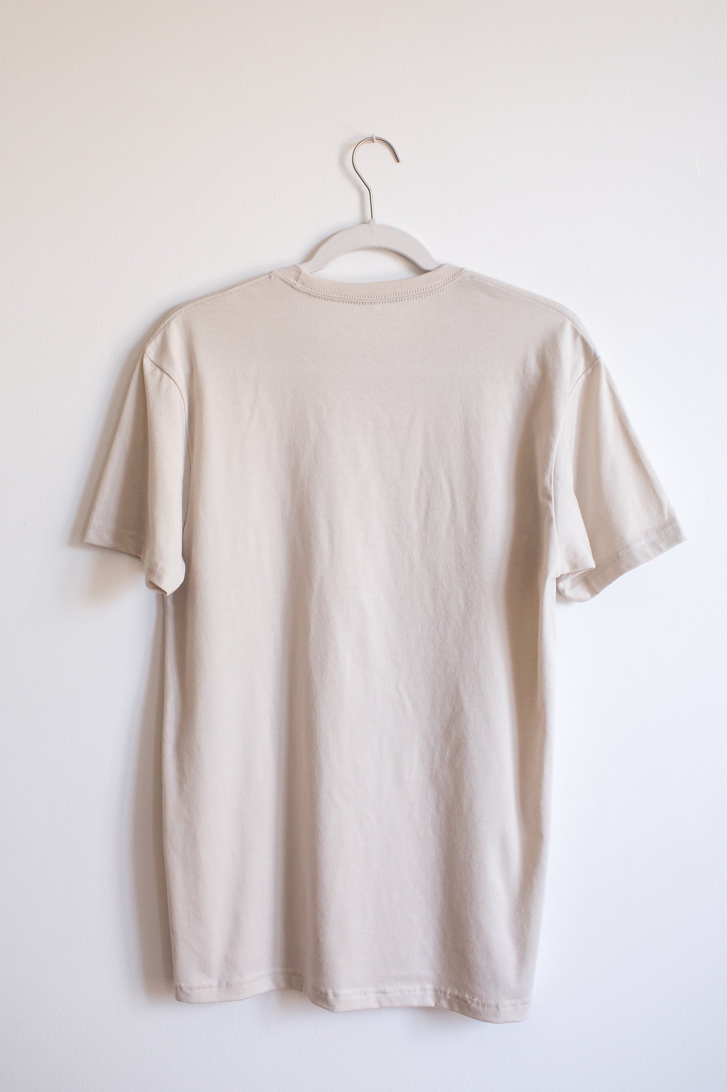 Back of sand colored sueded crewneck tee.