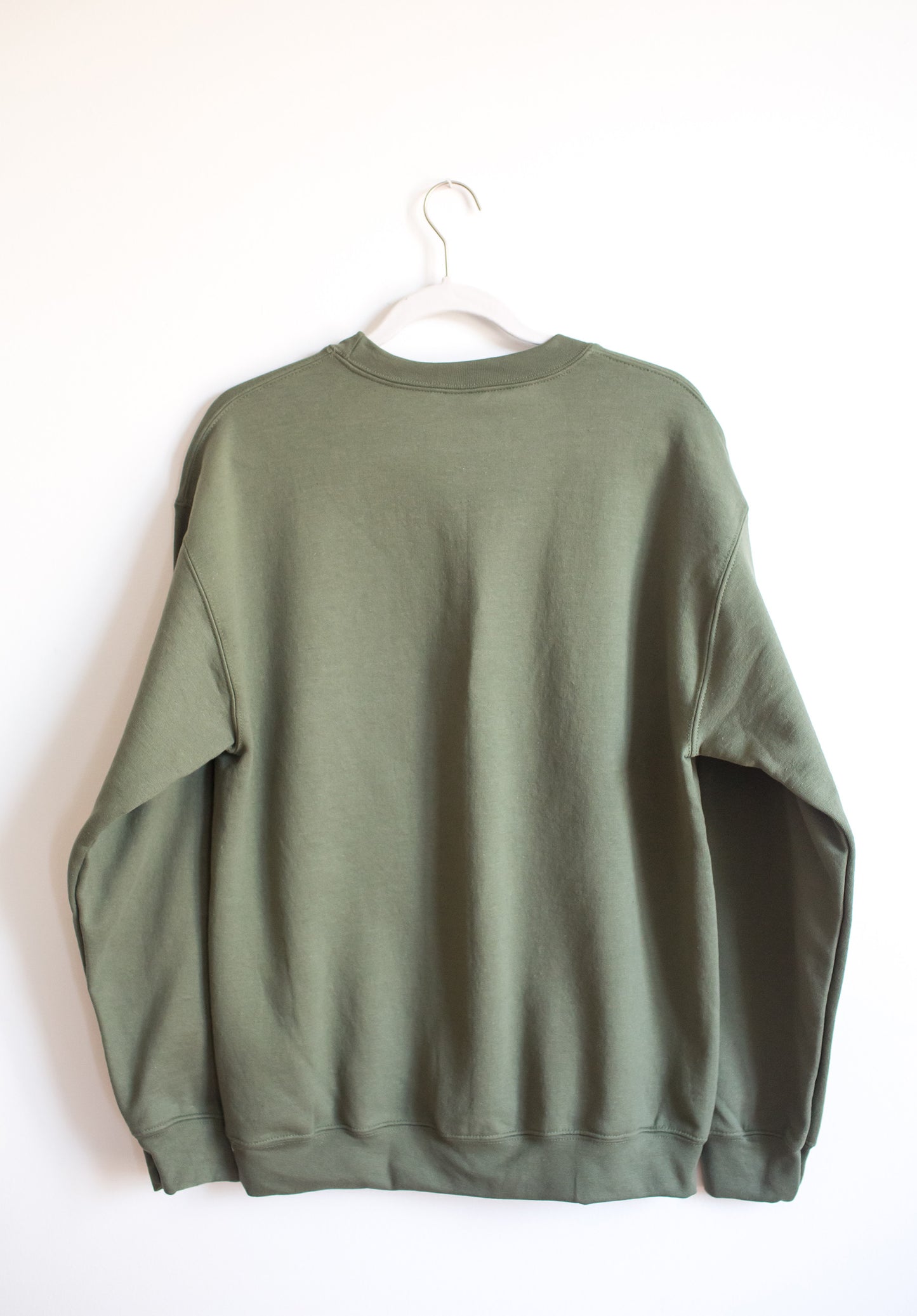 Back of military green crewneck sweatshirt.