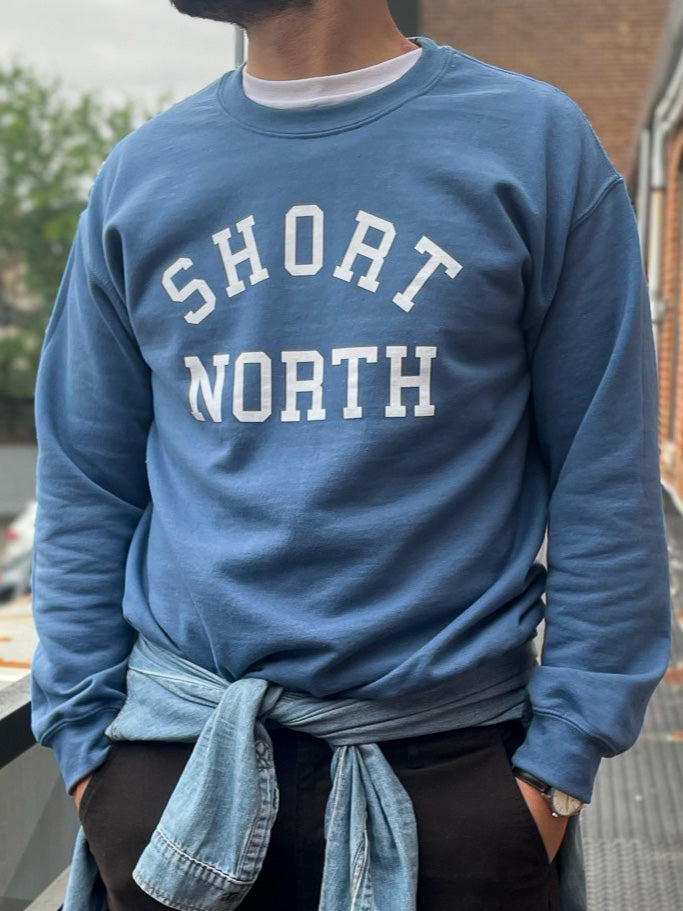 Hanging indigo blue Short North crewneck sweatshirt.