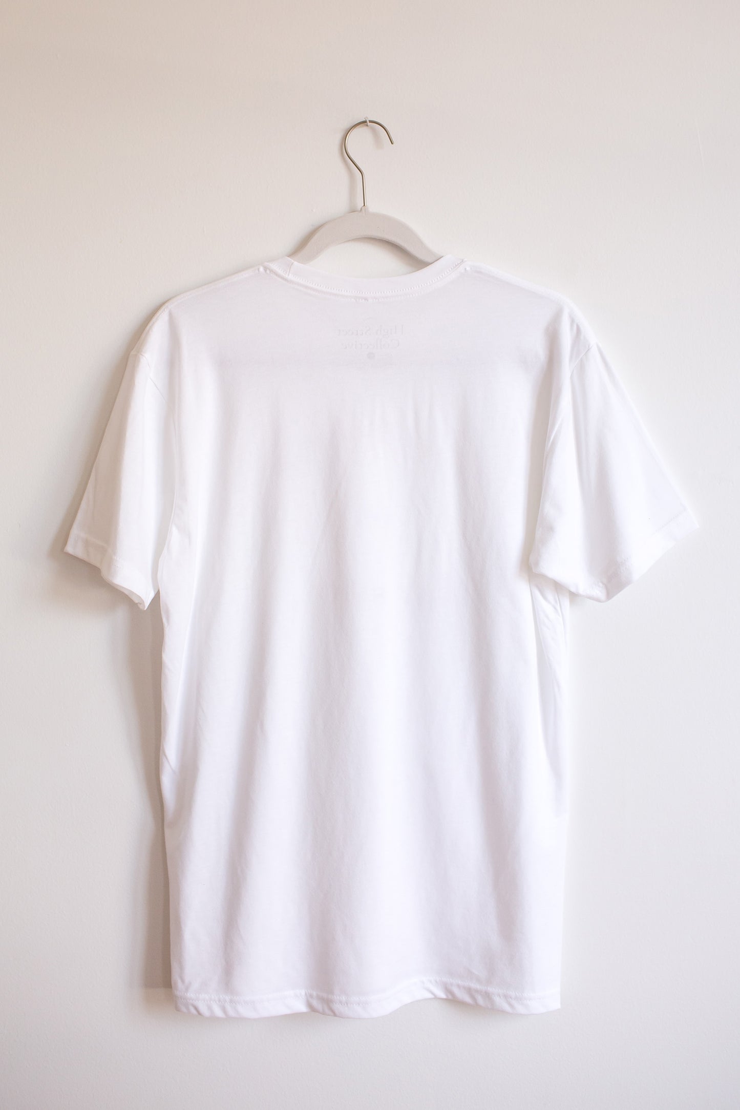 Back of hanging white sueded crewneck tee