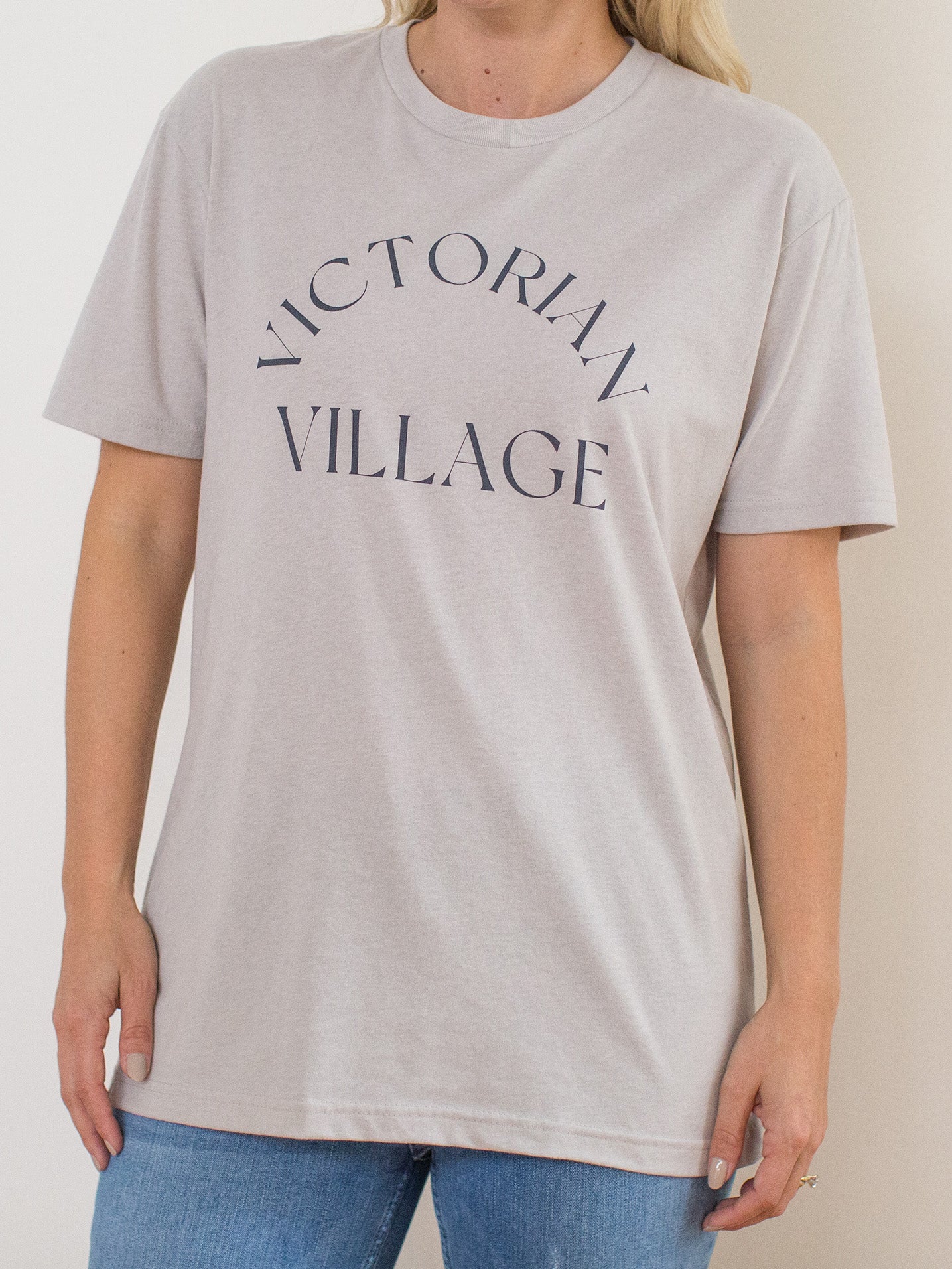 Model wearing light grey sueded crewneck tee with Victorian Village Columbus, Ohio graphic at front