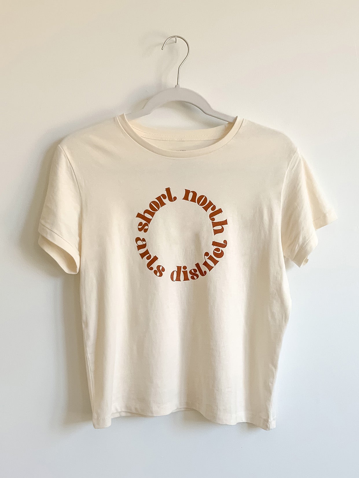 High-Waisted cream tee with Short North Arts District Columbus, Ohio circular graphic on front